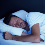 Man grinding his teeth in his sleep